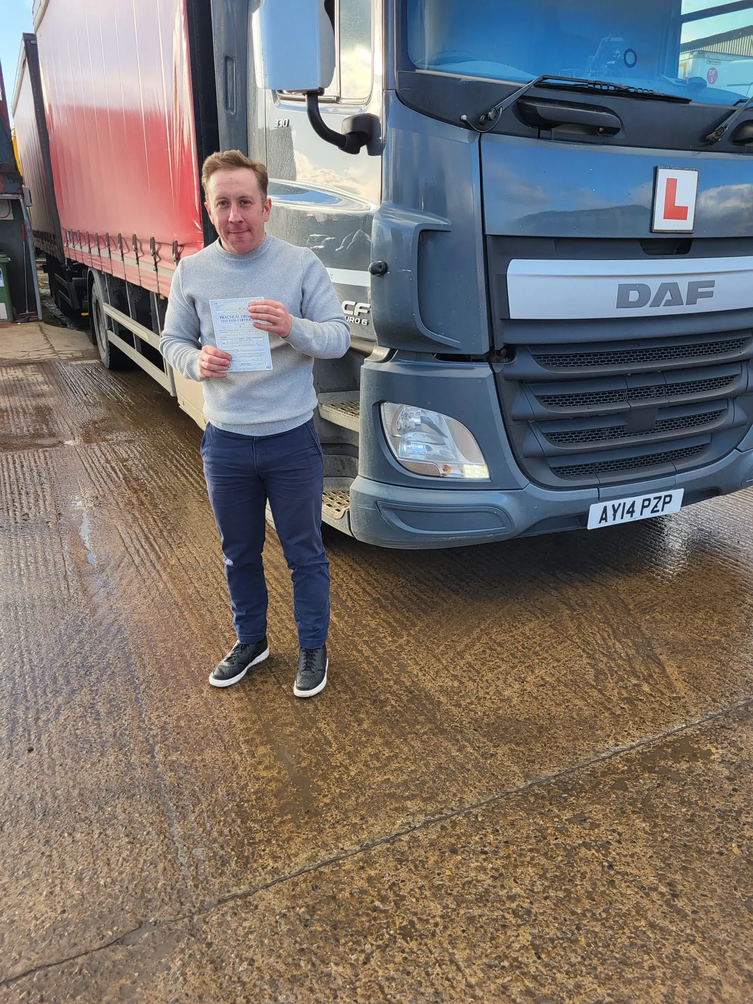 new driver with grey jumper